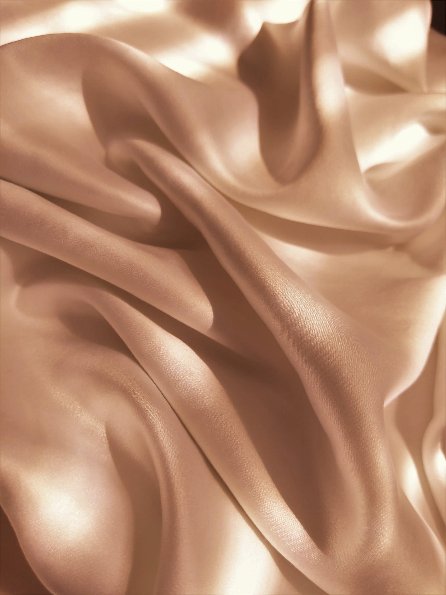 Photo of soft silky champagne-coloured fabric